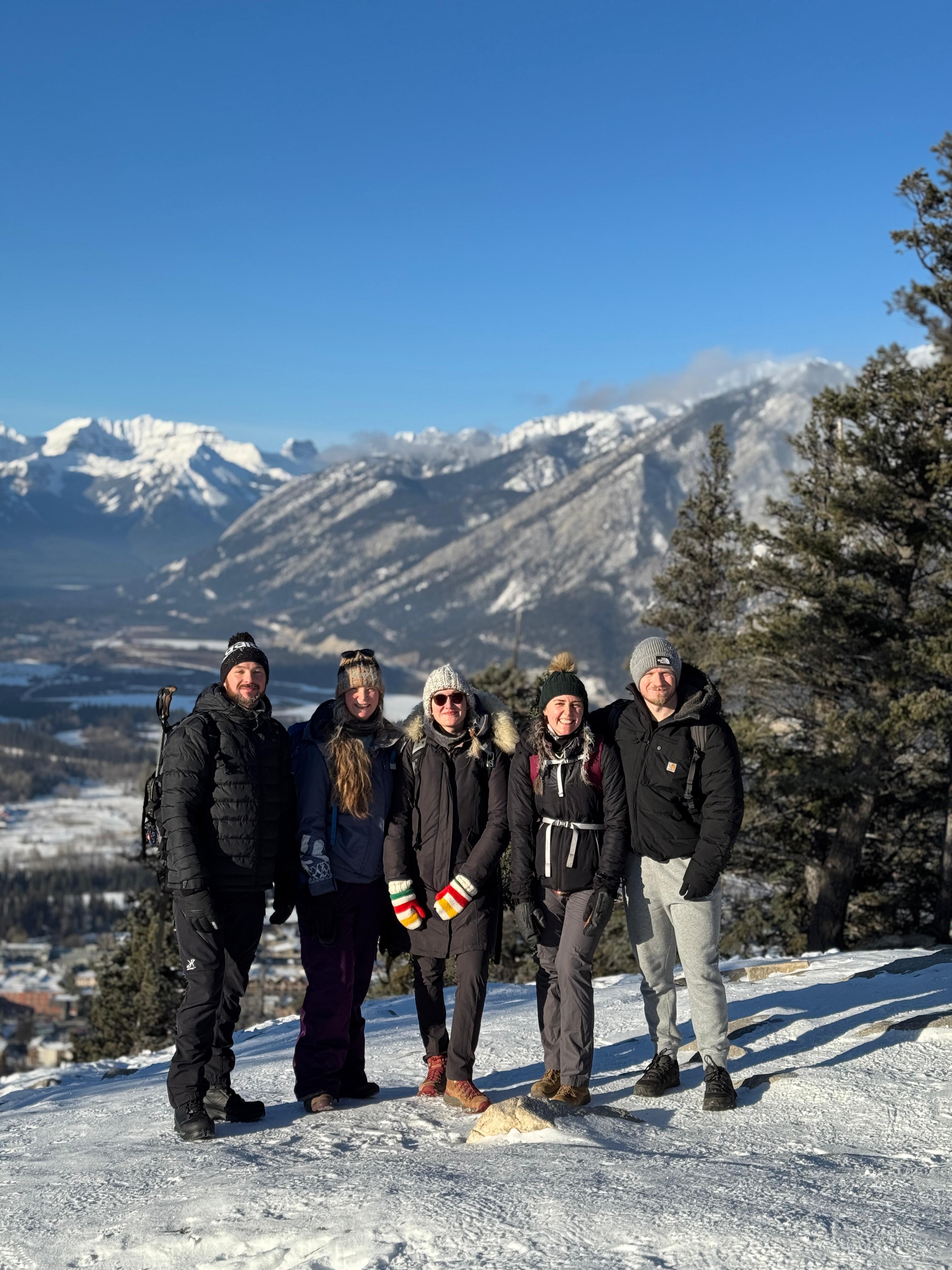 A group of hikers with the mountains in the background