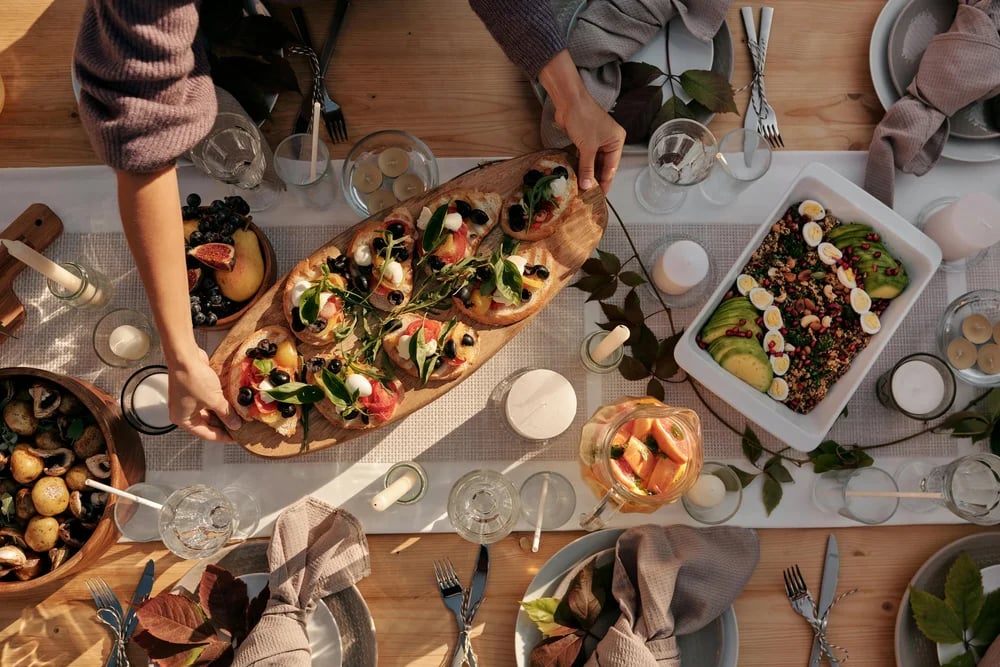 Appetizers being laid out on a table.
